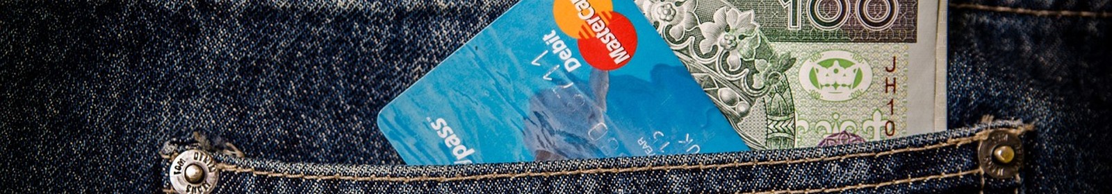 credit card and cash in back pocket of jeans