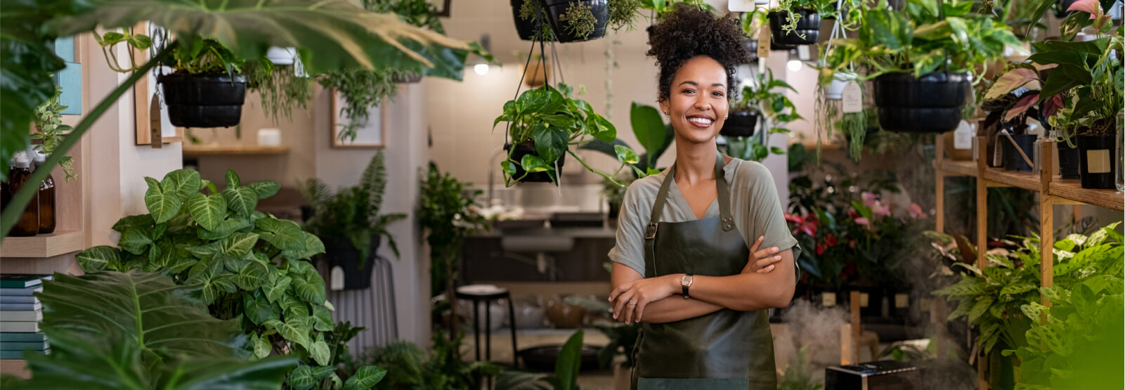 Woman standing in a plant shop