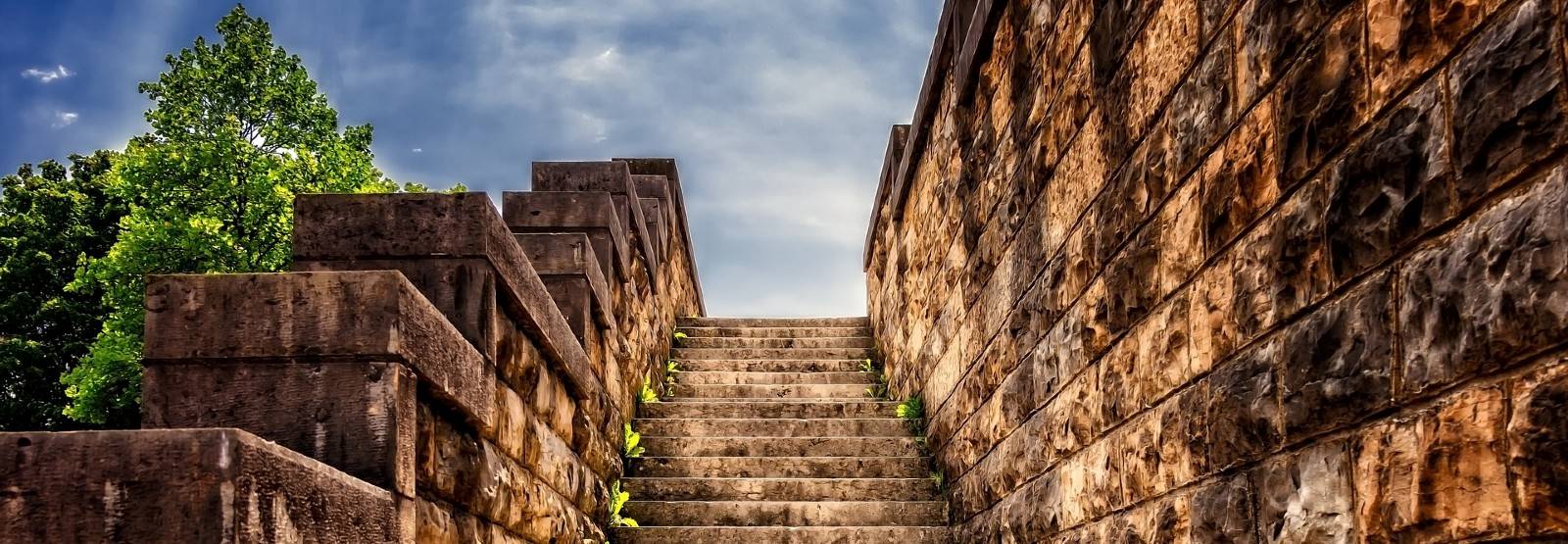 Open stairway between stone walls