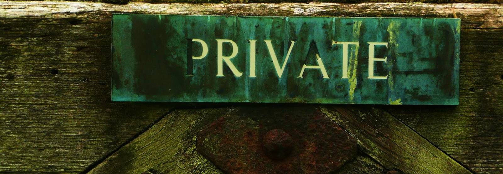 hanging sign that reads "private"